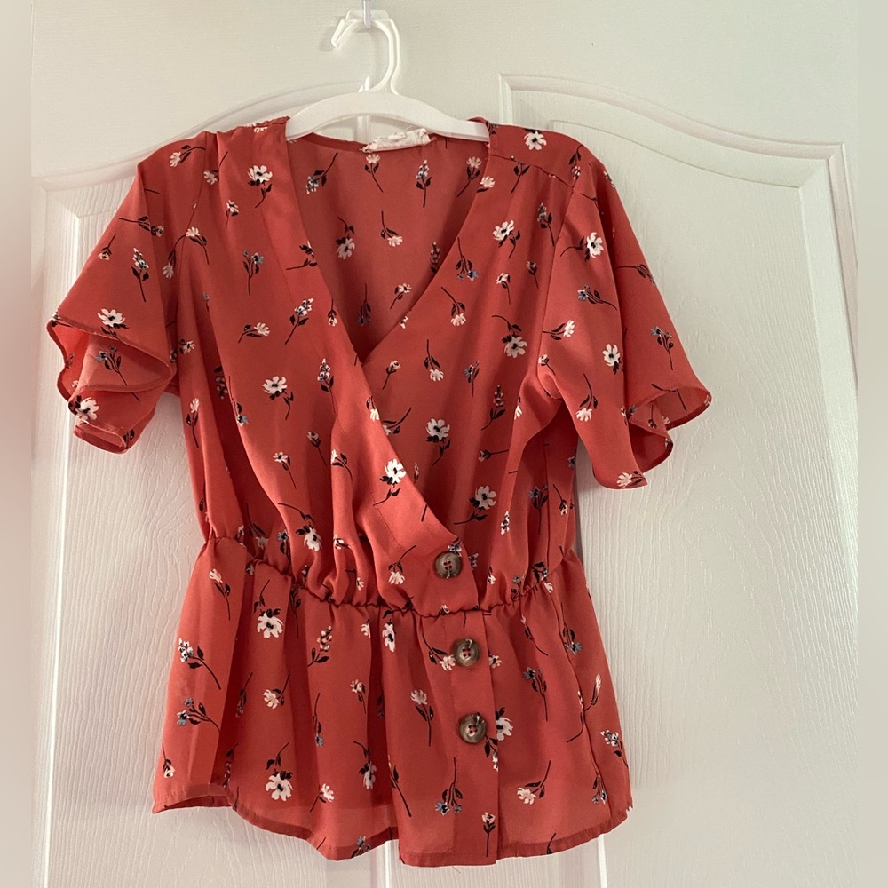 Orange blouse with flowers